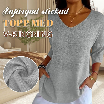 Enfärgad stickad topp med v-ringning