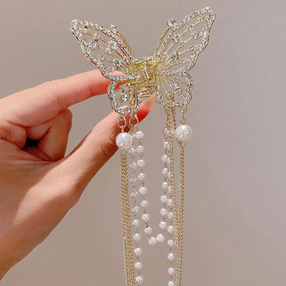 🦋✨ Glittrande Fjärilshårklämma med Tofs & Pärlor