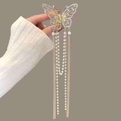 🦋✨ Glittrande Fjärilshårklämma med Tofs & Pärlor